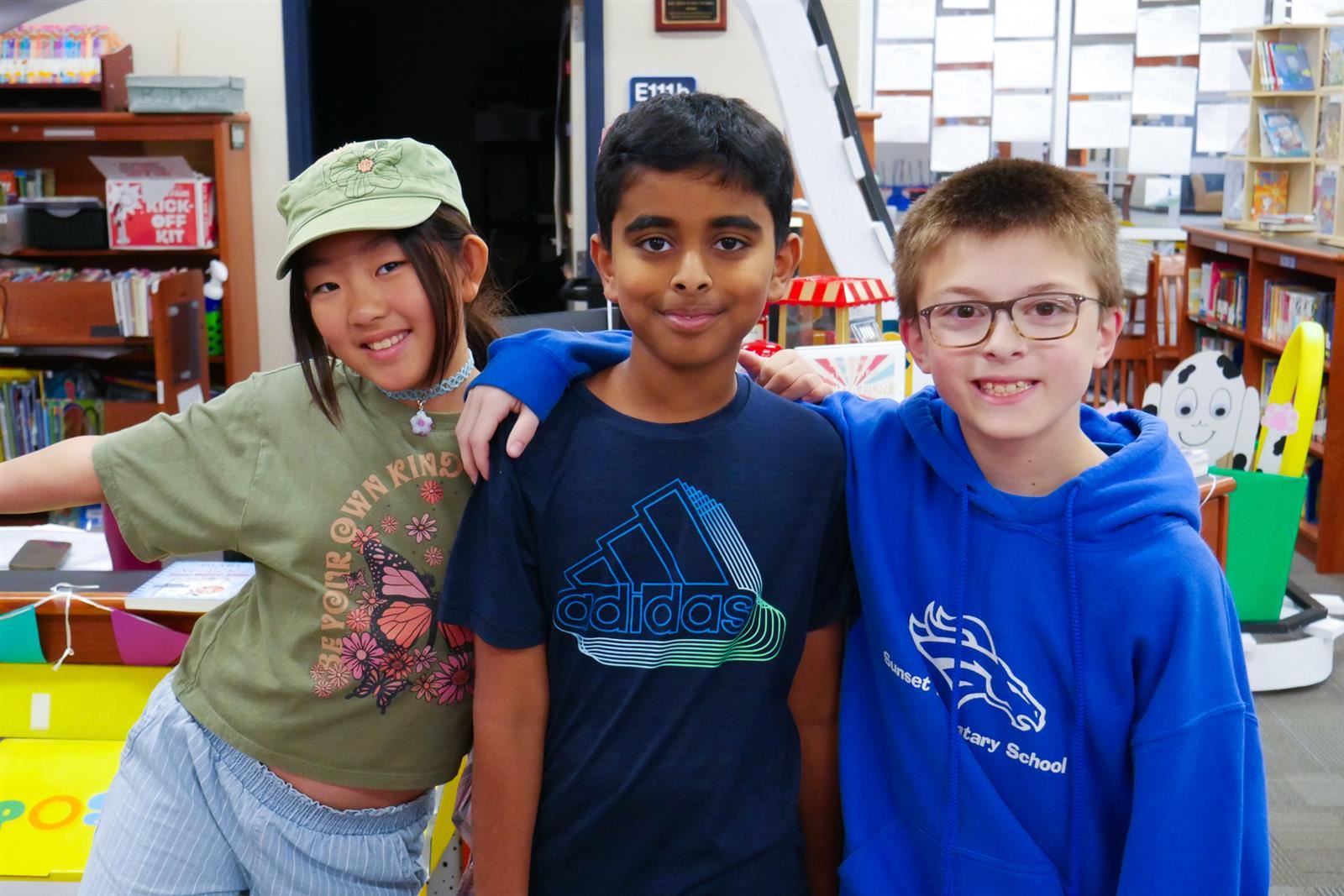 three students at the book fair